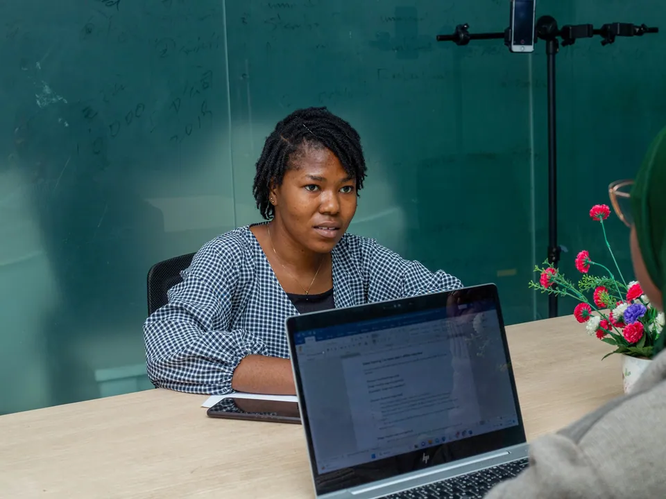 Young professional working on a laptop in a modern office in Lagos, Nigeria